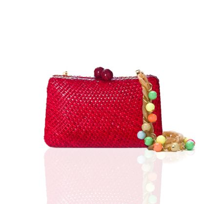 Knitted red bag with pendants